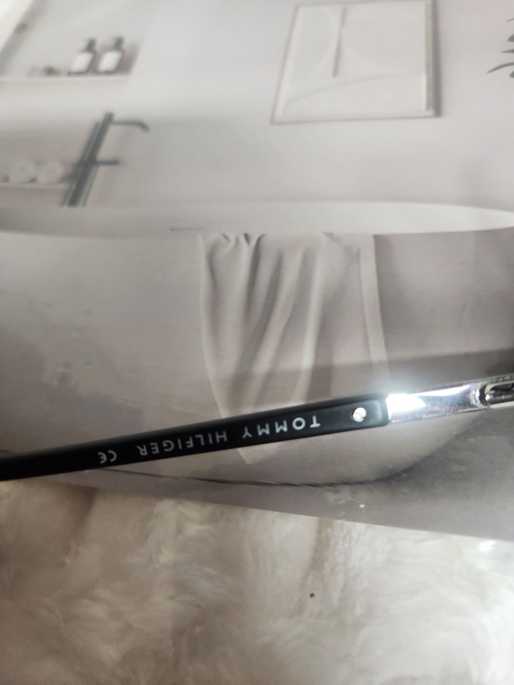 Eyeglass temple arm with printed model numbers